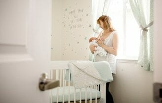 Peeking into gray and mint nursery room