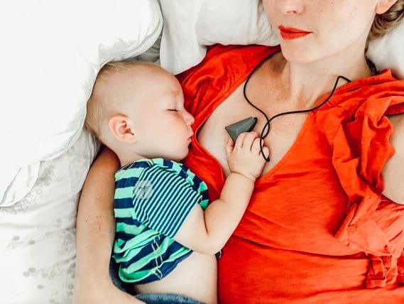 me and R sleeping-holding teething necklace