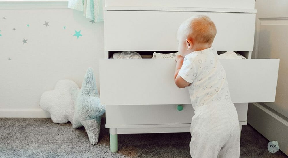 opening dresser full of Carter's baby clothes