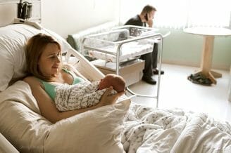 smiling at baby after birth