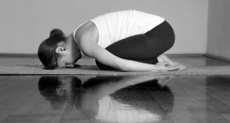 Girl doing Marichyasana A yoga pose