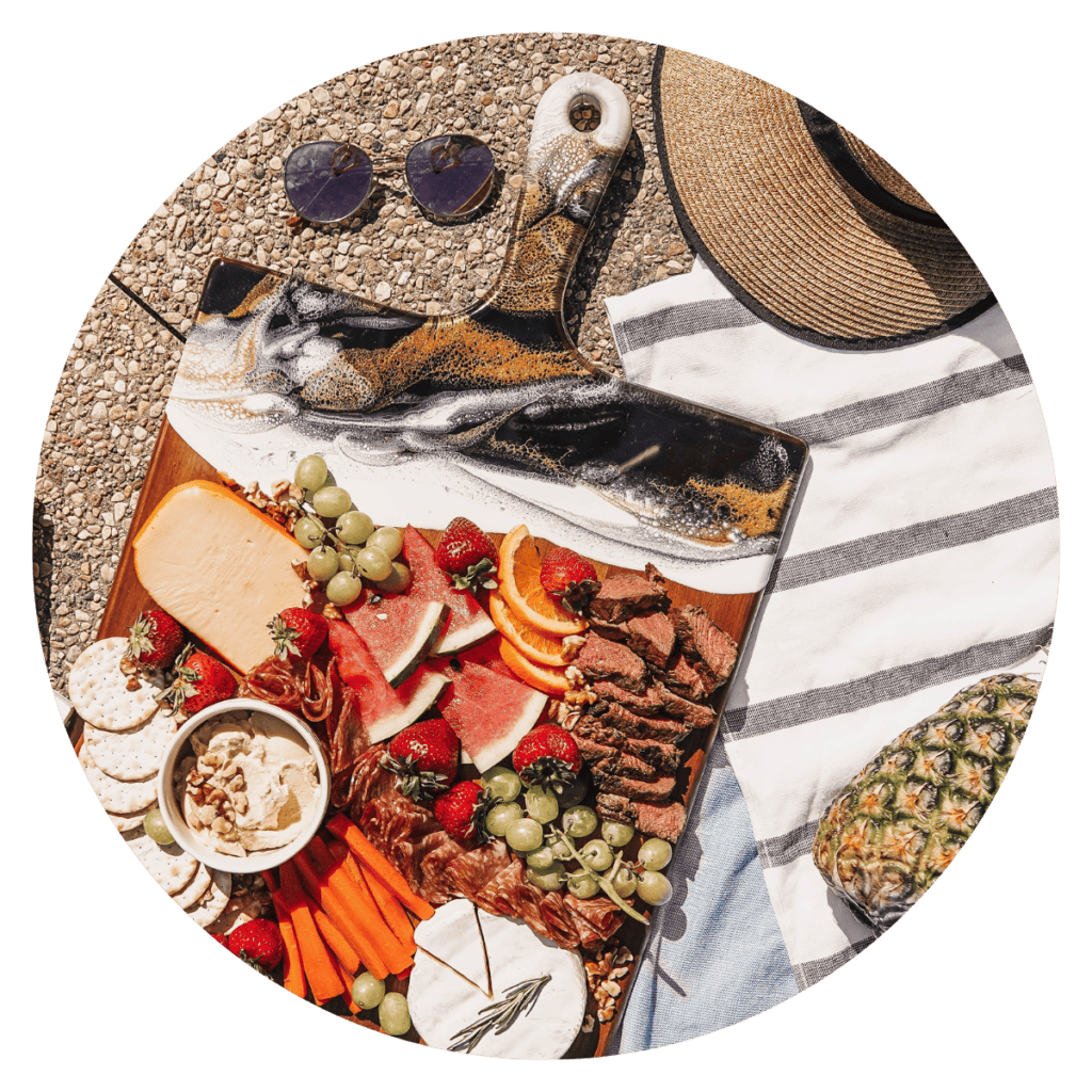 Flat lay of cutting board filled with meats and cheeses.